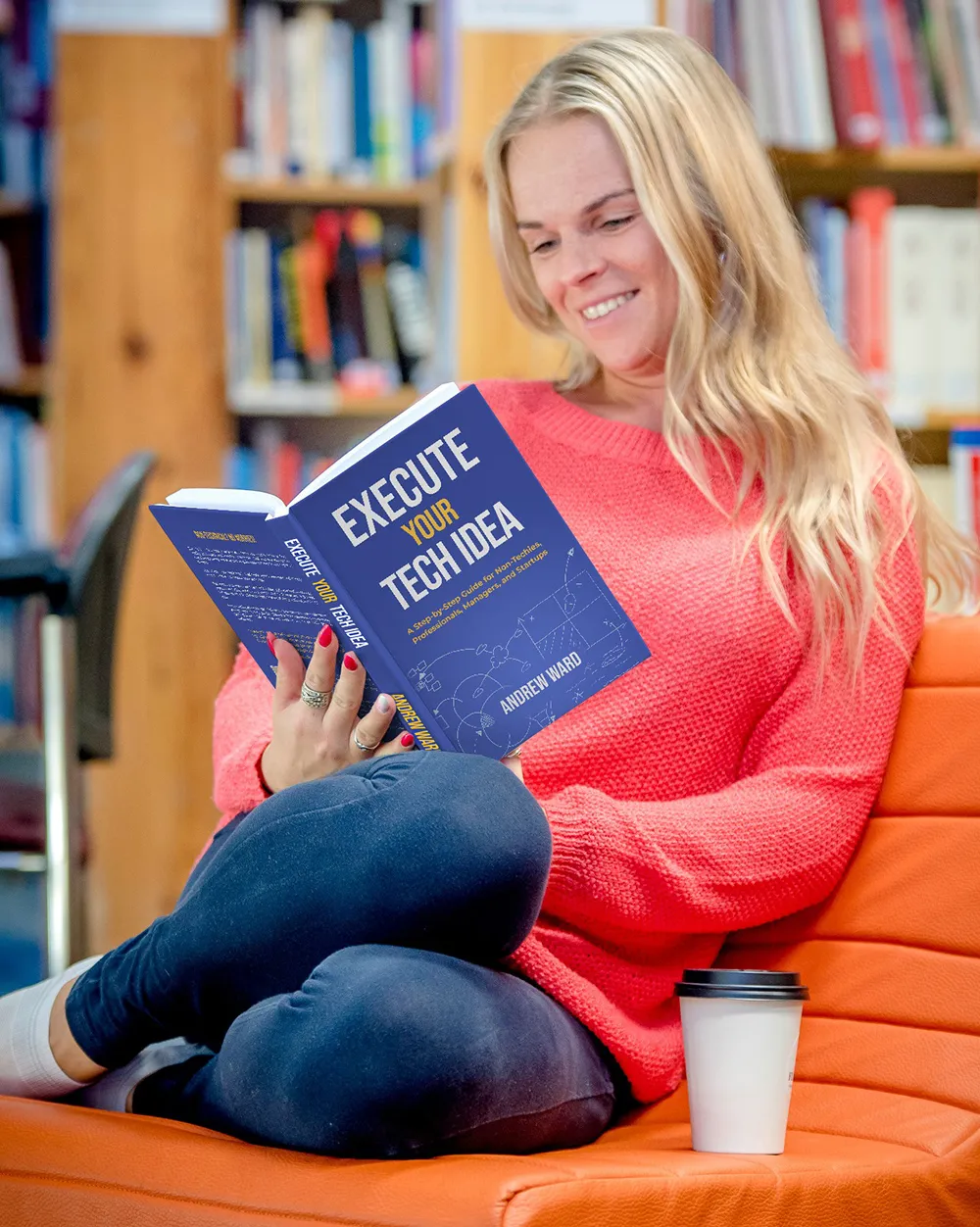 A woman reading Execute Your Tech Idea by Andrew Ward in a library